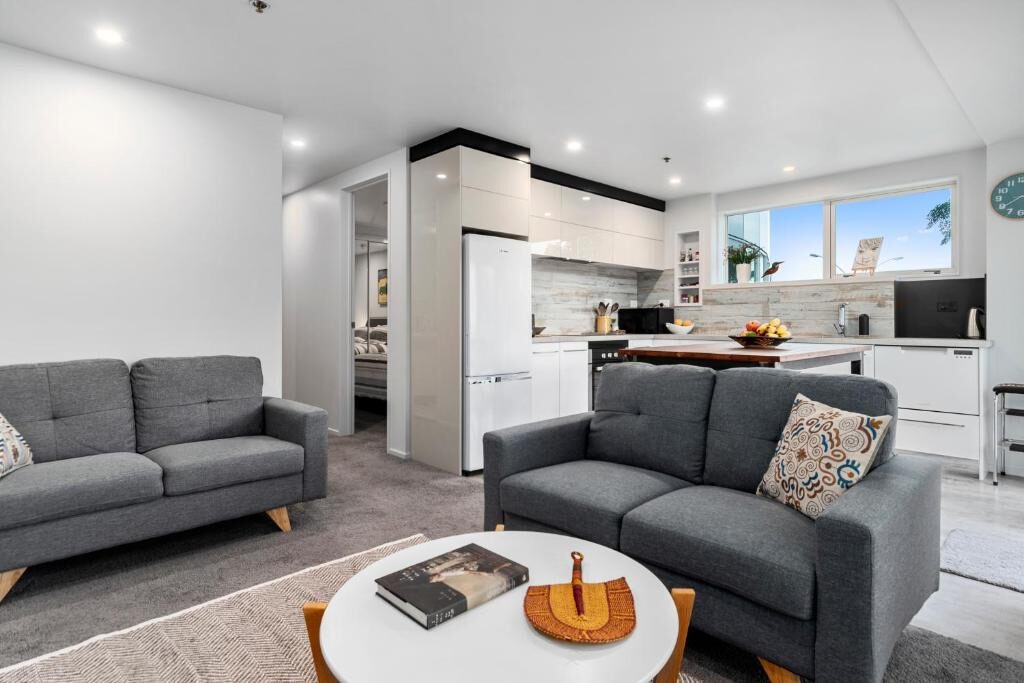 Open plan living room and kitchen of the Kingsview CBD Tauranga apartment
